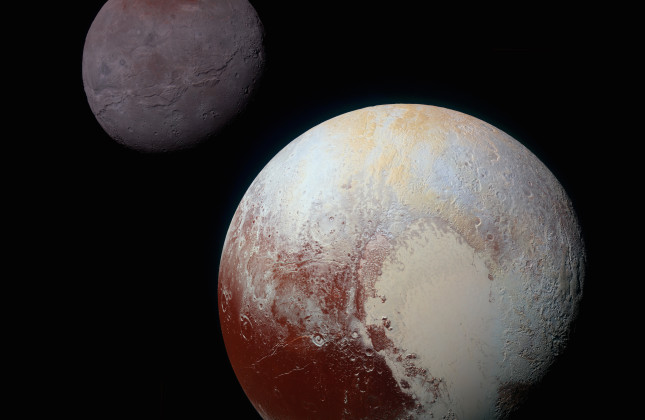 Pluto en zijn grote maan Charon. Het grote ovale gebied op Pluto heet Sputnik Planitia.  © NASA/JHUAPL/SWRI